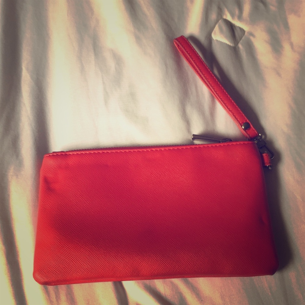 Chic red clutch with wrist strap